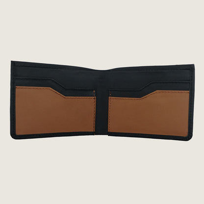 An open bifold wallet with a black exterior and tan interior card slots, shown against a light gray background.