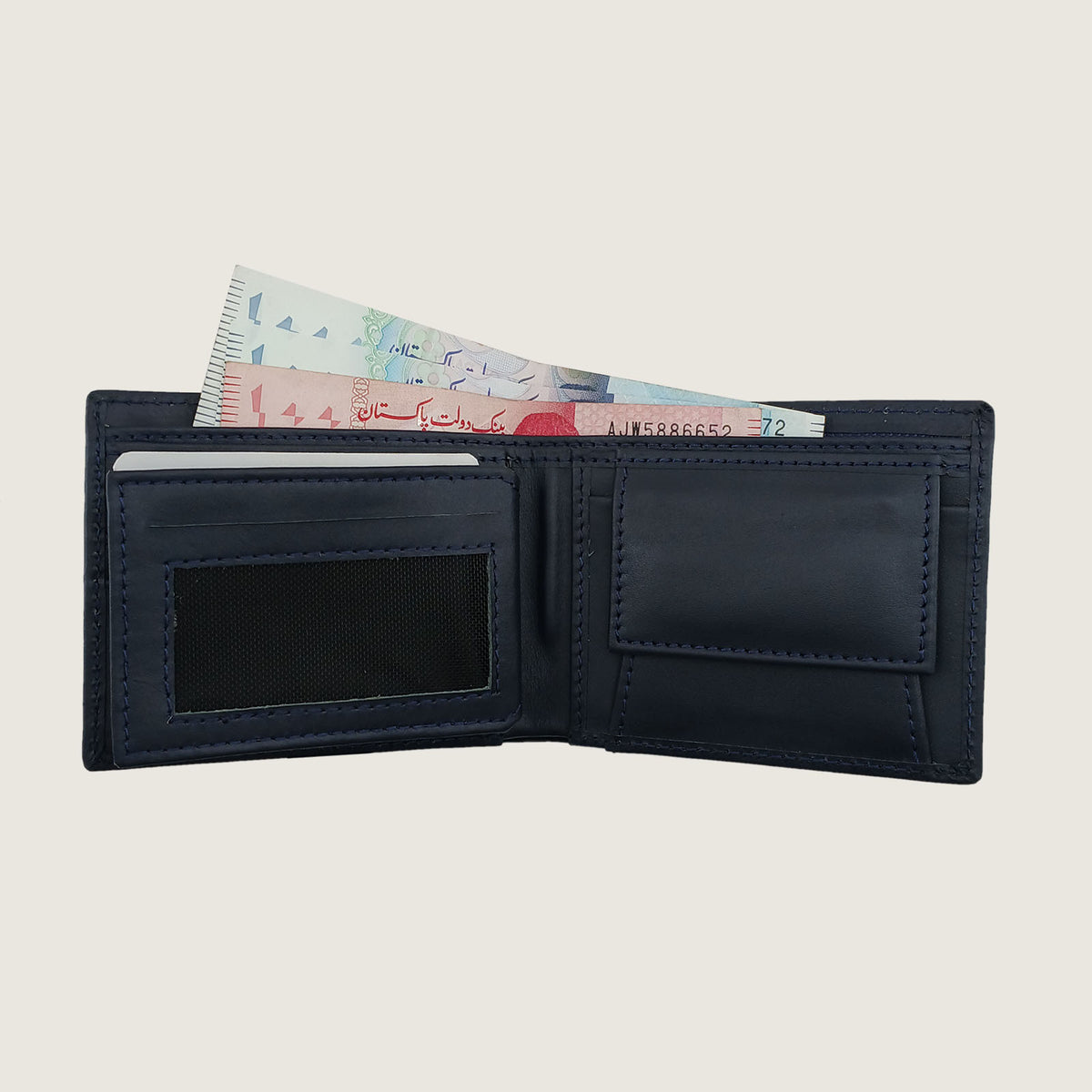 A dark navy blue leather bi-fold wallet shown open, displaying its interior compartments, including a card slot with banknotes inserted, a black mesh ID window, and blank card slots, set against a solid light beige background.