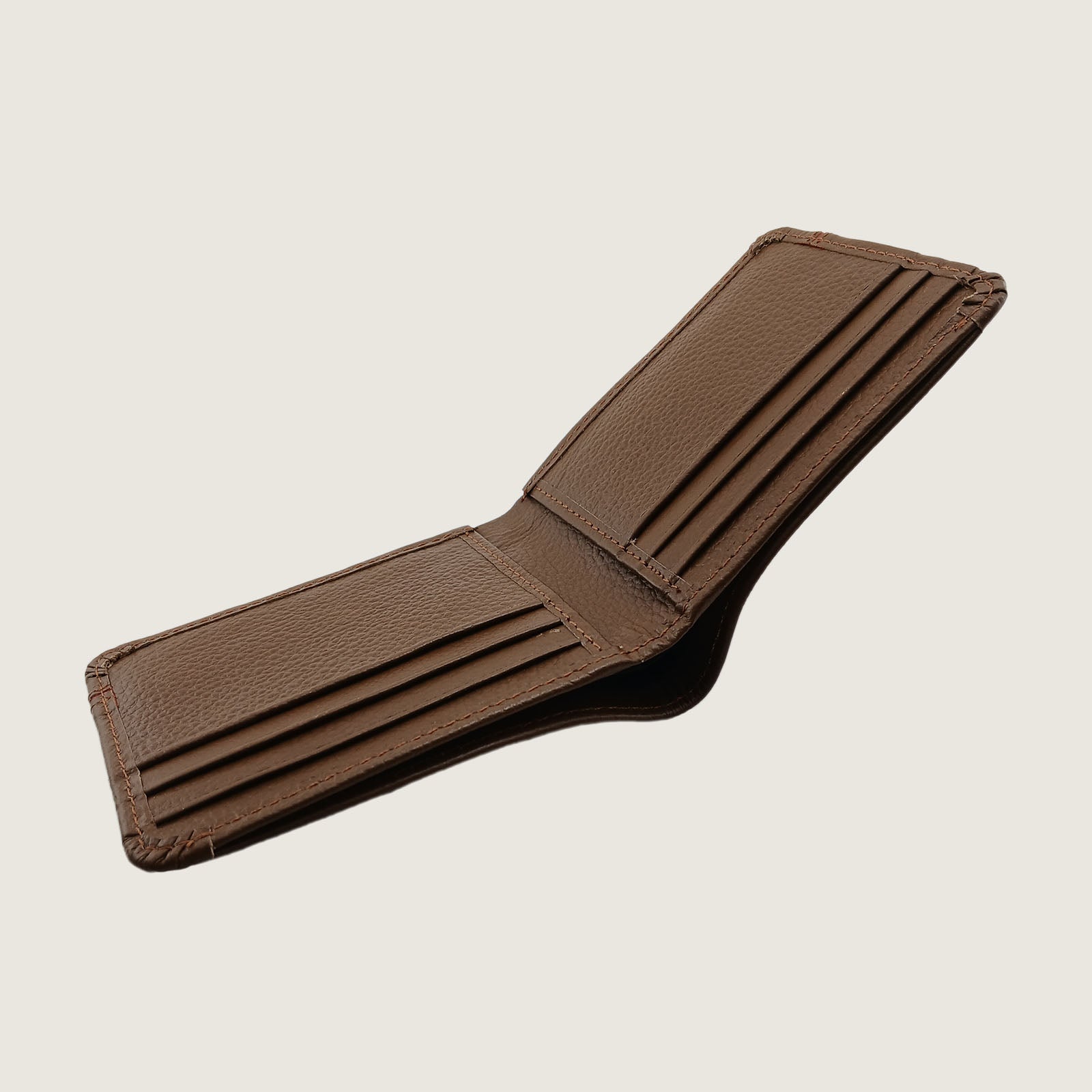 A brown textured leather bifold wallet for men with a thin red horizontal stripe across the center