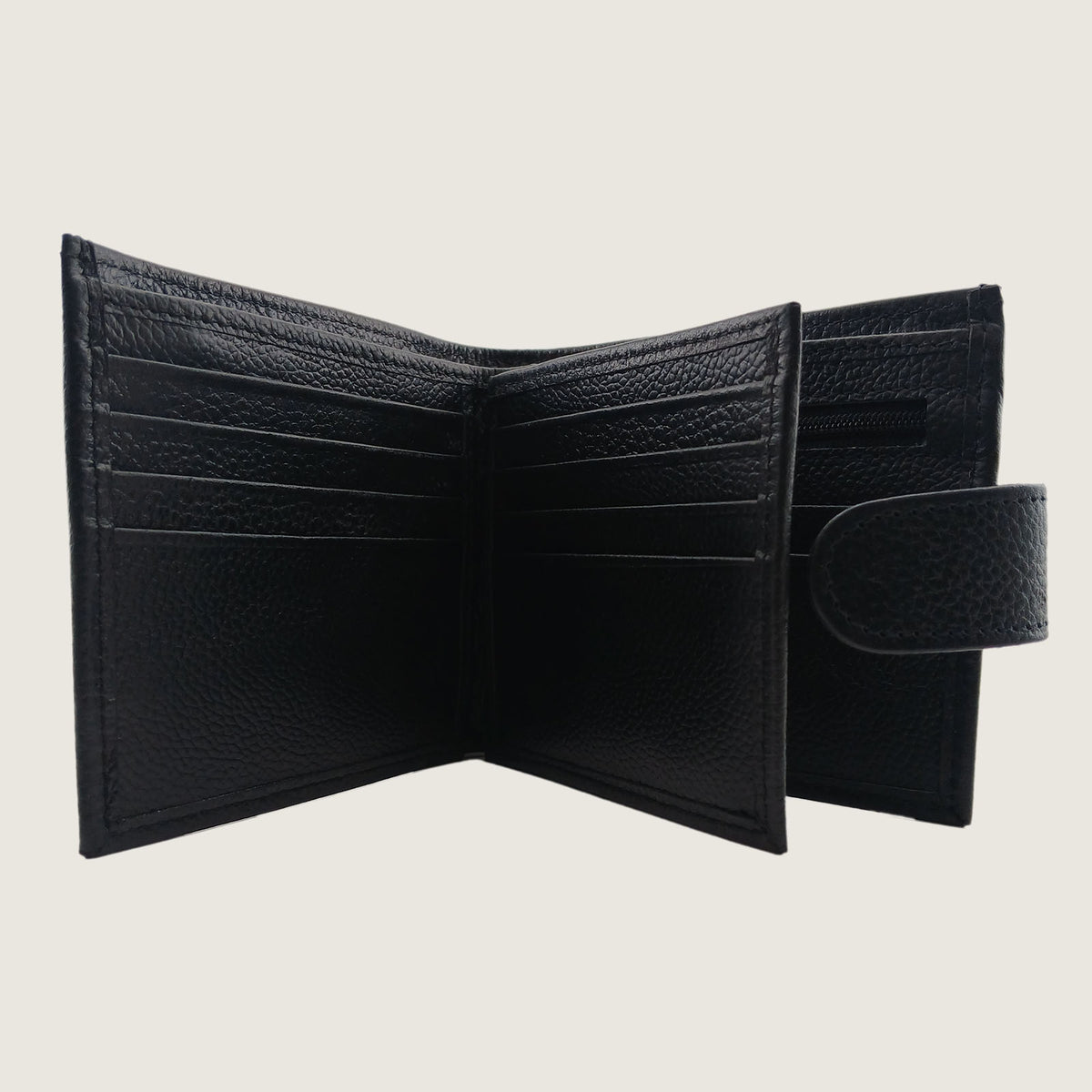An open black textured leather bifold wallet with multiple card slots and an interior zip compartment, shown against a light beige background.
