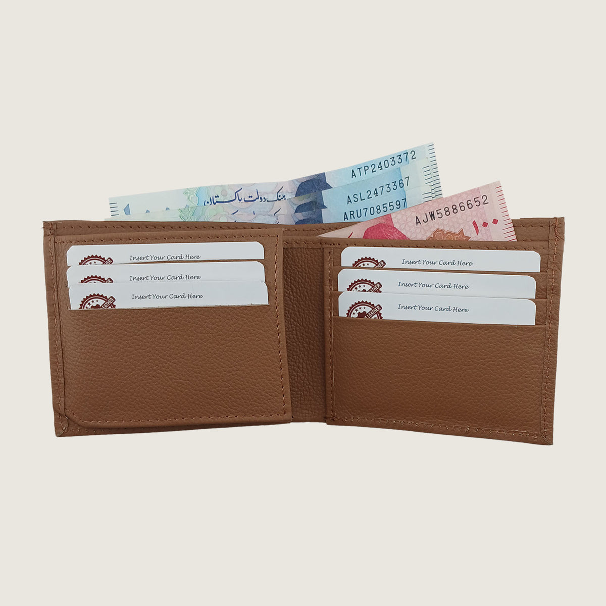A brown leather bi-fold wallet shown open, containing several sample credit cards and banknotes, photographed against a plain light beige background.