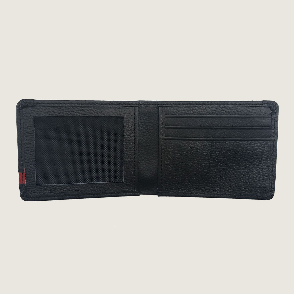A black textured leather bifold wallet shown open, displaying its interior compartments including an ID window, card slots, and a small red and green stripe detail on the left edge, set against a solid light beige background.