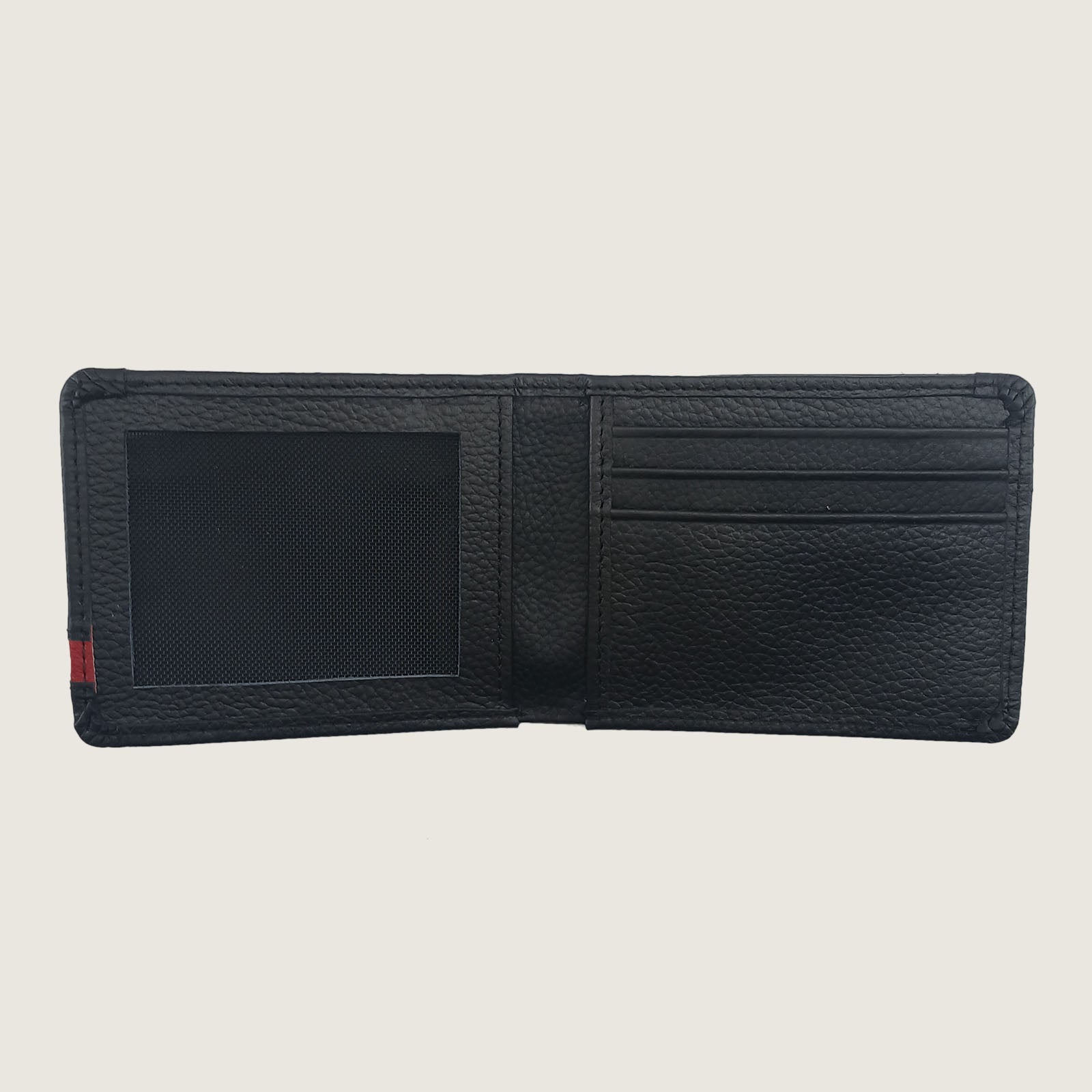 A black textured leather bifold wallet shown open, displaying its interior compartments including an ID window, card slots, and a small red and green stripe detail on the left edge, set against a solid light beige background.