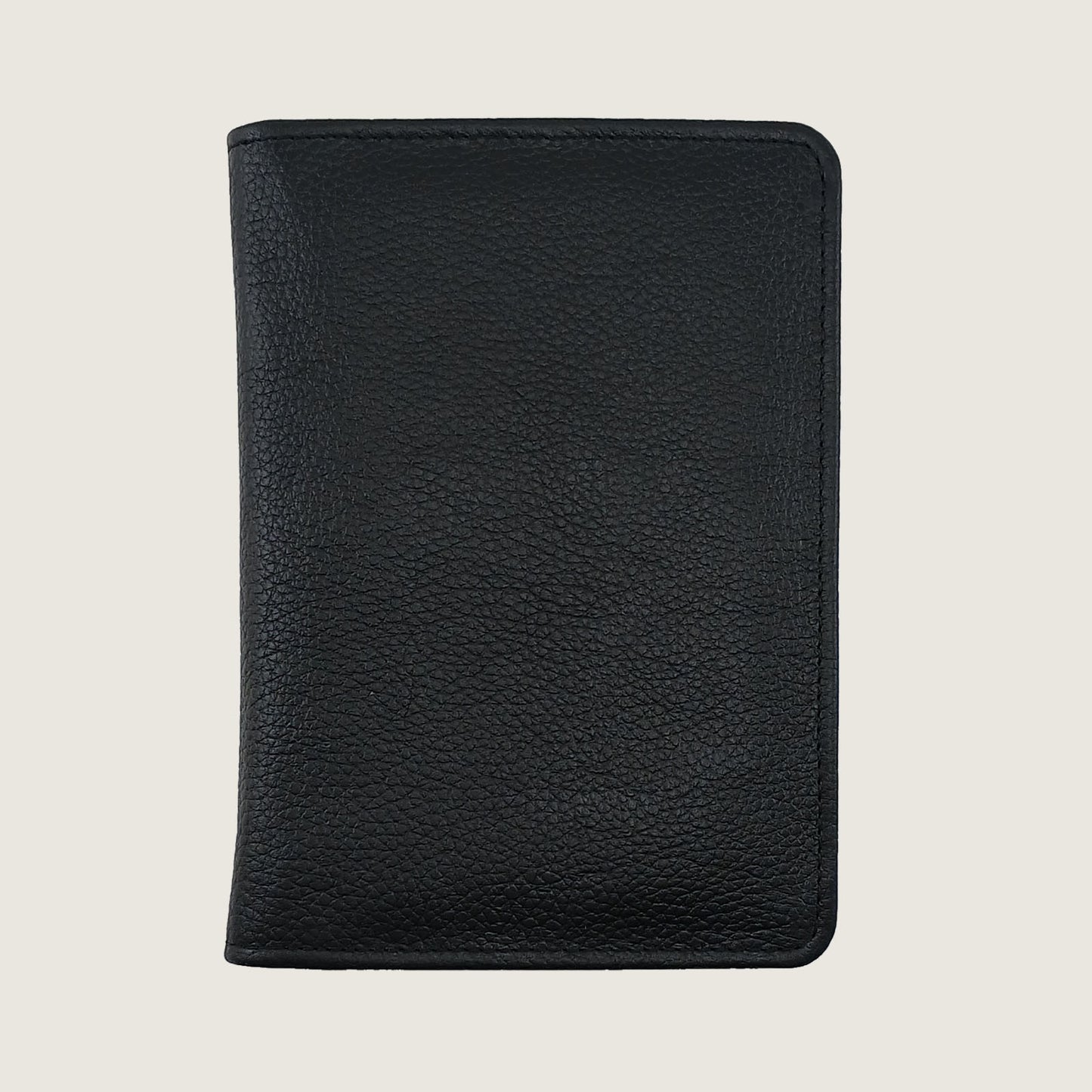 A black pebbled leather passport cover or document holder, shown closed from the front against a light beige background.