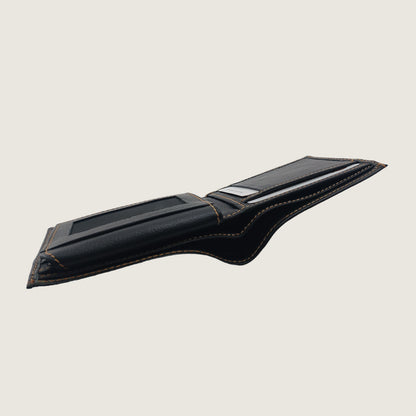 A black leather card holder wallet with gold contrast stitching, shown open against a solid light beige background.